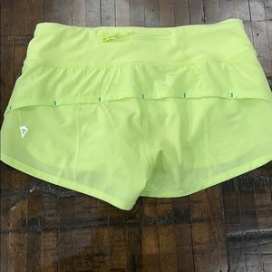 Girls Adorable bright yellow Ivivva shorts.